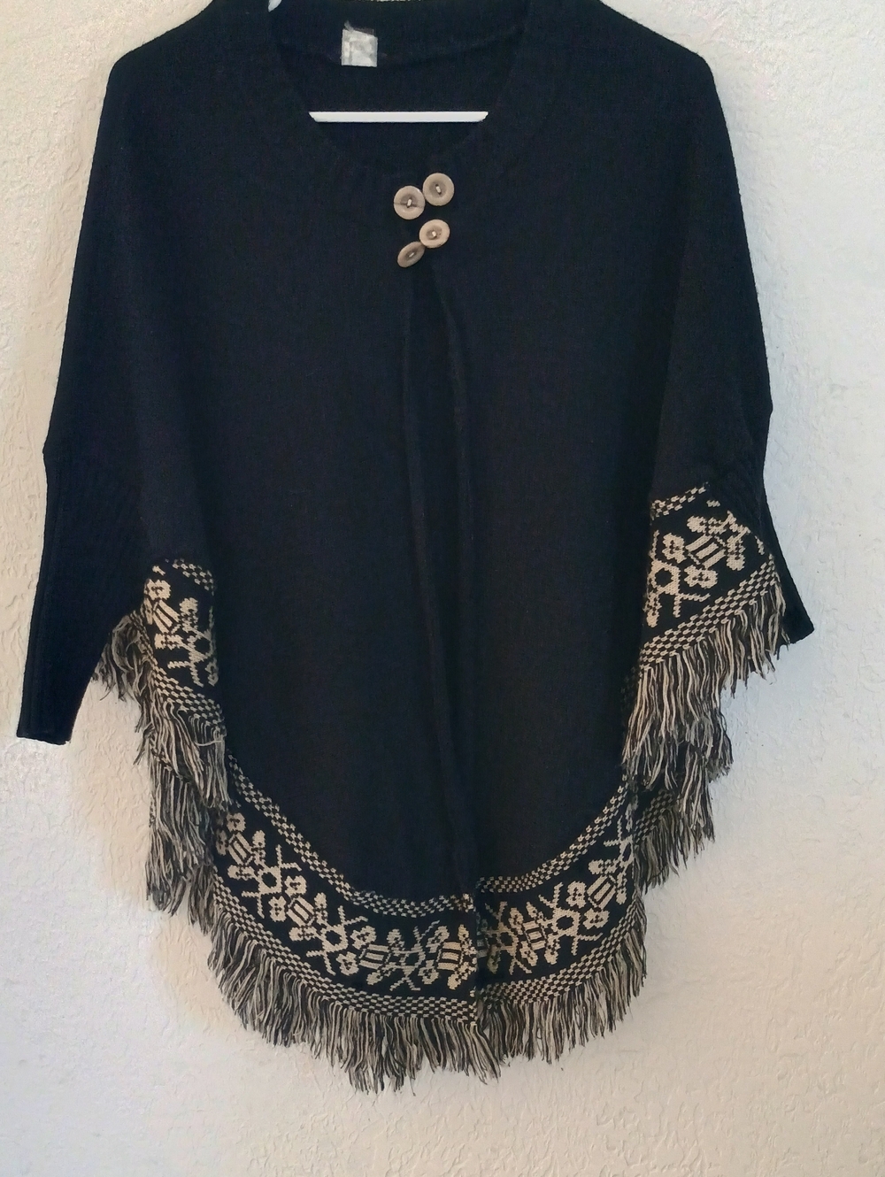 Black Poncho Sweater with Cream Trim and Button Accents